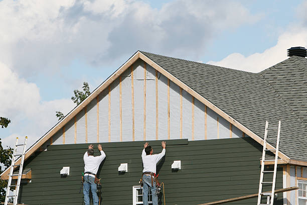 Professional Storm Damage Siding Repair technician working in Amherst, VA